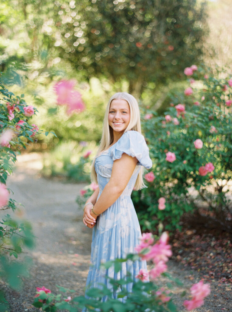 Senior portrait in the oak-lined alley at Rosedown Plantation in Saint Francisville, LA, photographed by Morgan Alysse Photography.