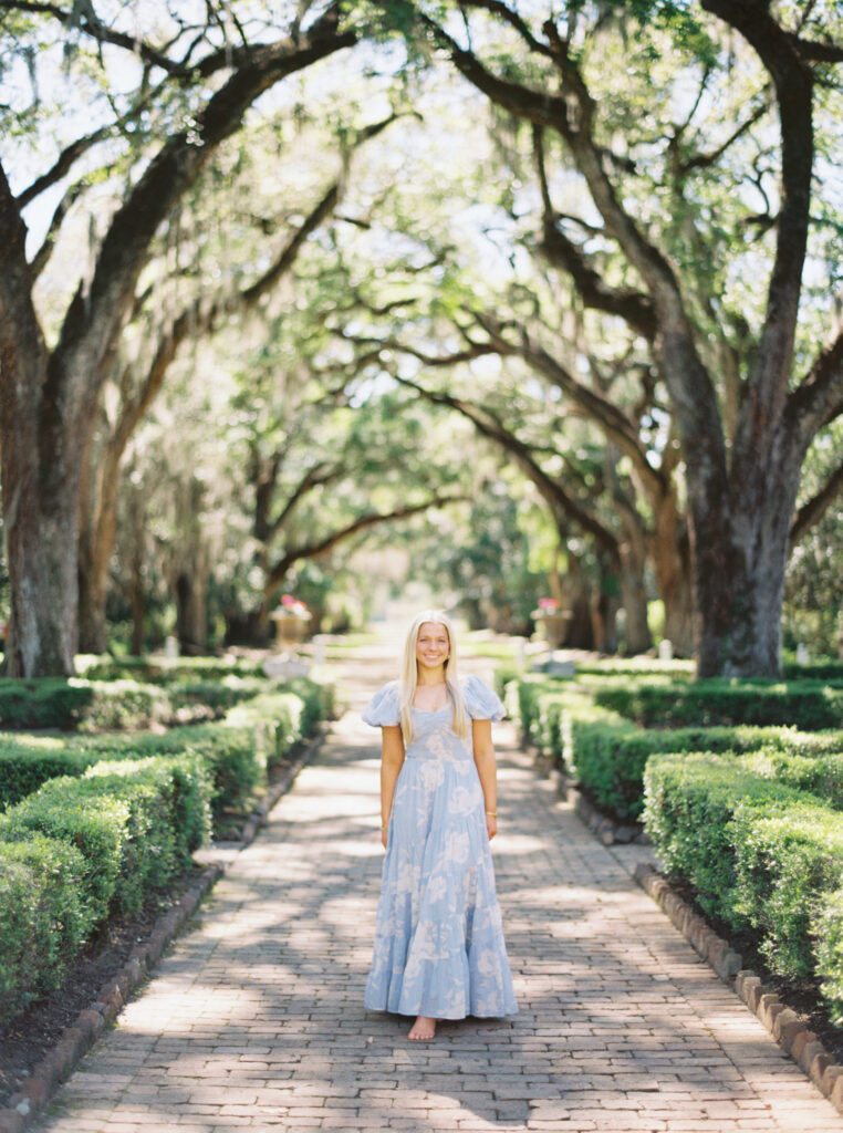 Senior portrait in the oak-lined alley at Rosedown Plantation in Saint Francisville, LA, photographed by Morgan Alysse Photography.