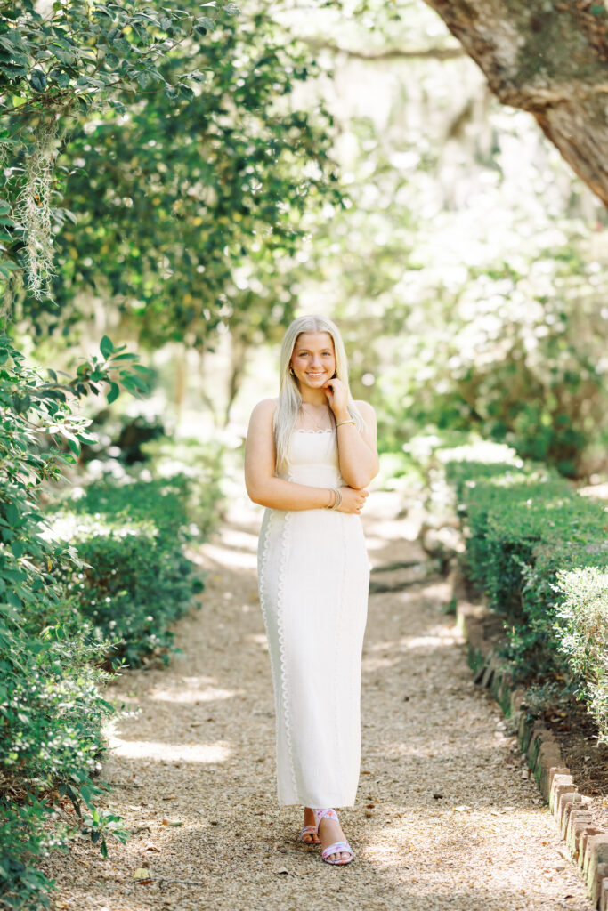 Amy standing in the gardens at Rosedown Plantation during her senior session at Rosedown Plantation, photographed by Morgan Alysse Photography