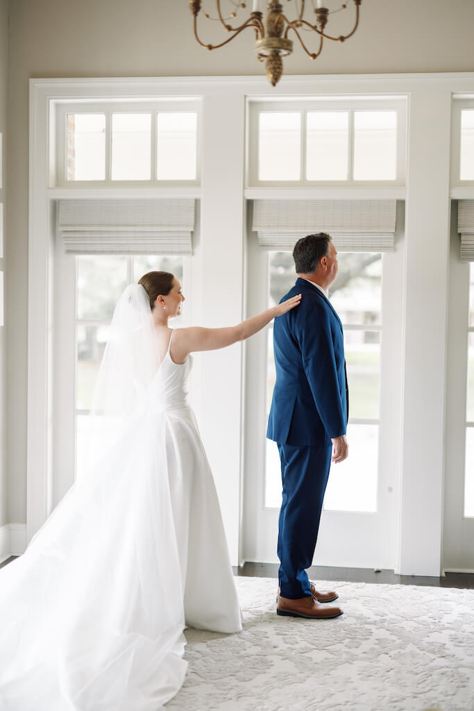 Father and daughter first look at Olivia and Landon's Oak Crossing Wedding in Lake Charles, LA, photographed by Morgan Alysse Photography.