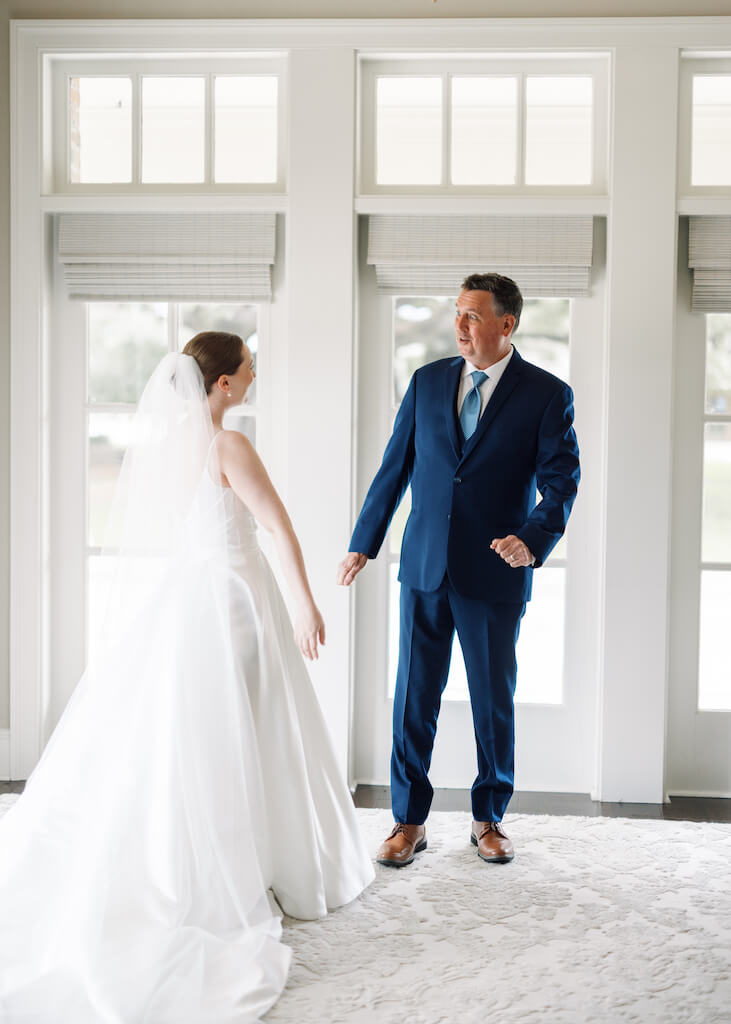 Father and daughter first look at Olivia and Landon's Oak Crossing Wedding in Lake Charles, LA, photographed by Morgan Alysse Photography.