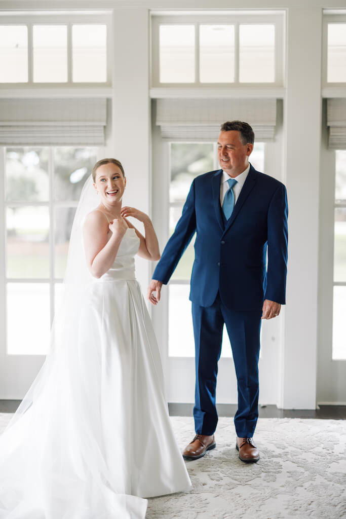 Father and daughter first look at Olivia and Landon's Oak Crossing Wedding in Lake Charles, LA, photographed by Morgan Alysse Photography.