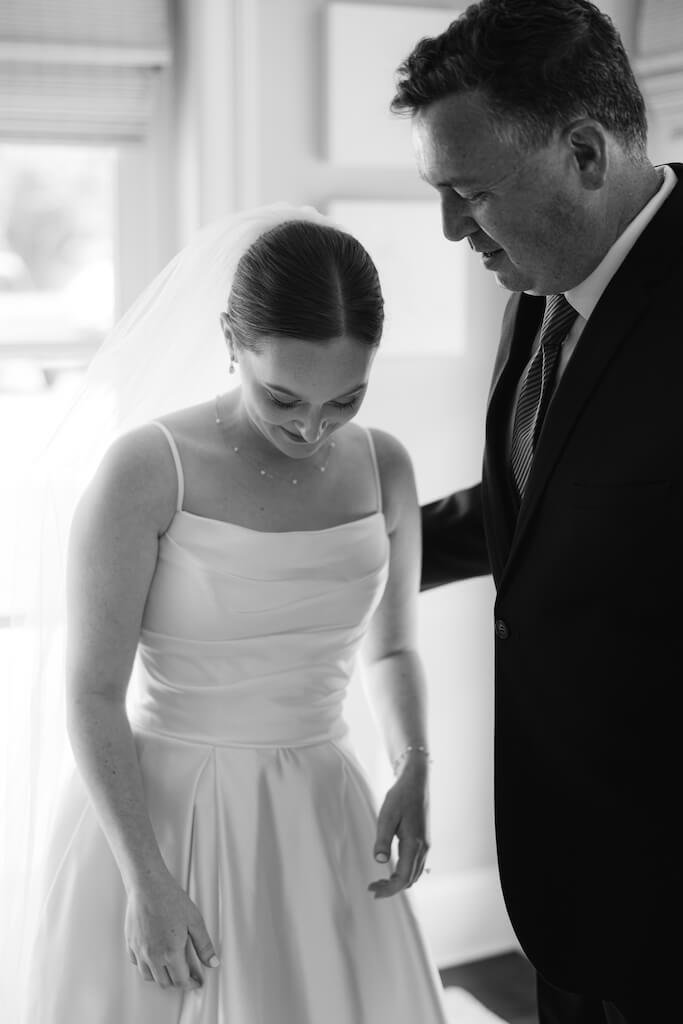 Father and daughter first look at Olivia and Landon's Oak Crossing Wedding in Lake Charles, LA, photographed by Morgan Alysse Photography.