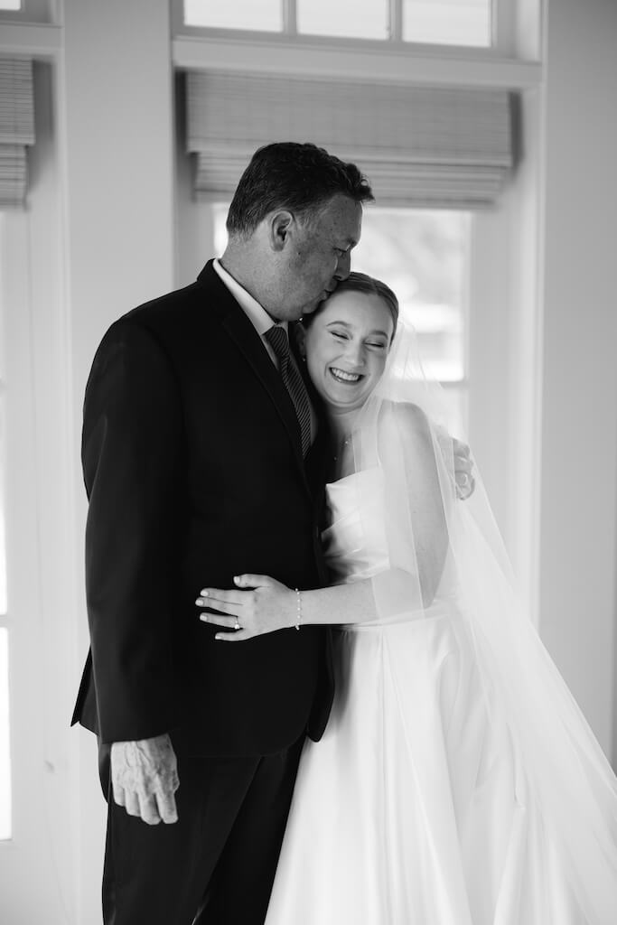 Father and daughter first look at Olivia and Landon's Oak Crossing Wedding in Lake Charles, LA, photographed by Morgan Alysse Photography.