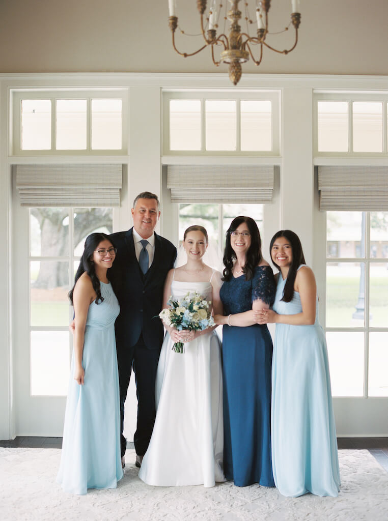 Family portrait at Olivia and Landon's Oak Crossing Wedding in Lake Charles, LA, photographed by Morgan Alysse Photography.