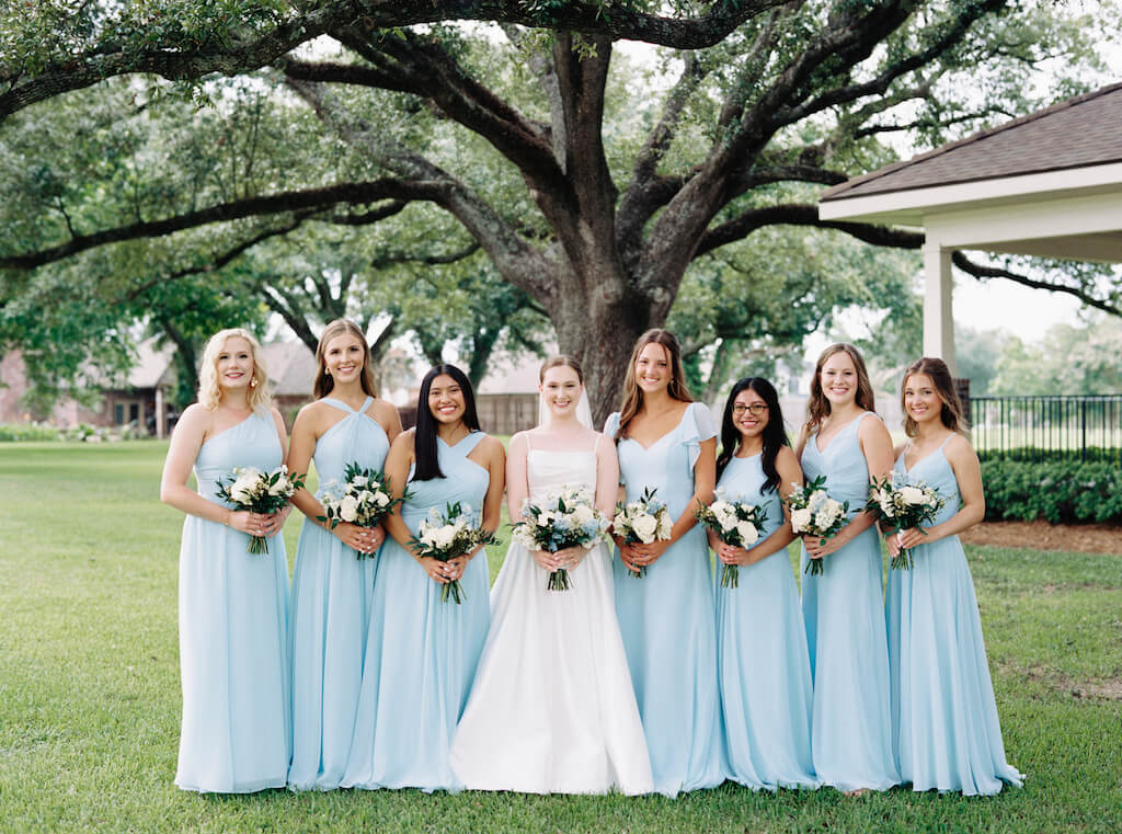 Bride with bridesmaids portrait at Olivia and Landon's Oak Crossing Wedding in Lake Charles, LA, photographed by Morgan Alysse Photography.