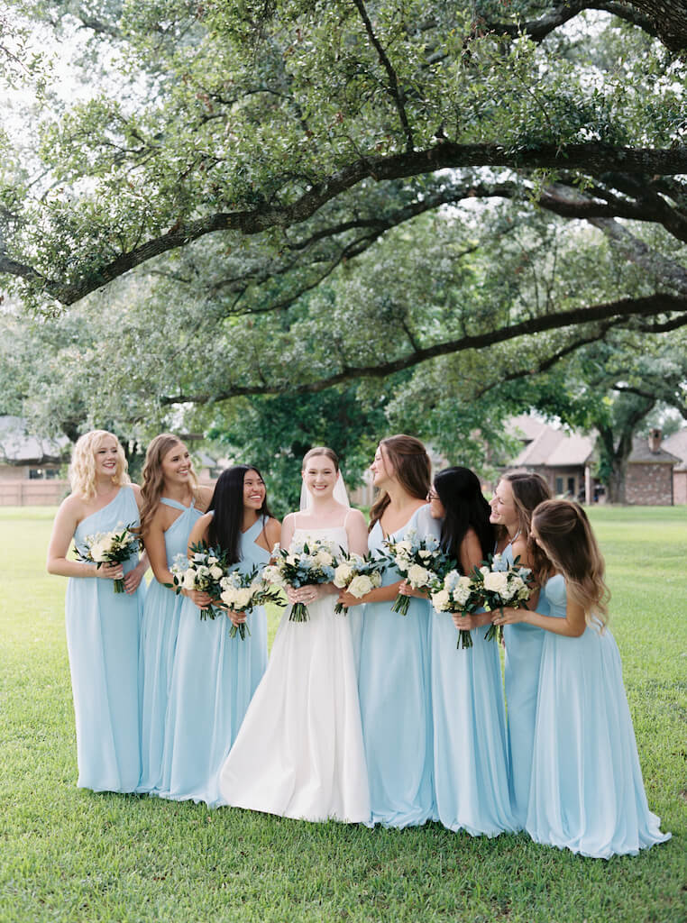 Bride with bridesmaids portrait at Olivia and Landon's Oak Crossing Wedding in Lake Charles, LA, photographed by Morgan Alysse Photography.