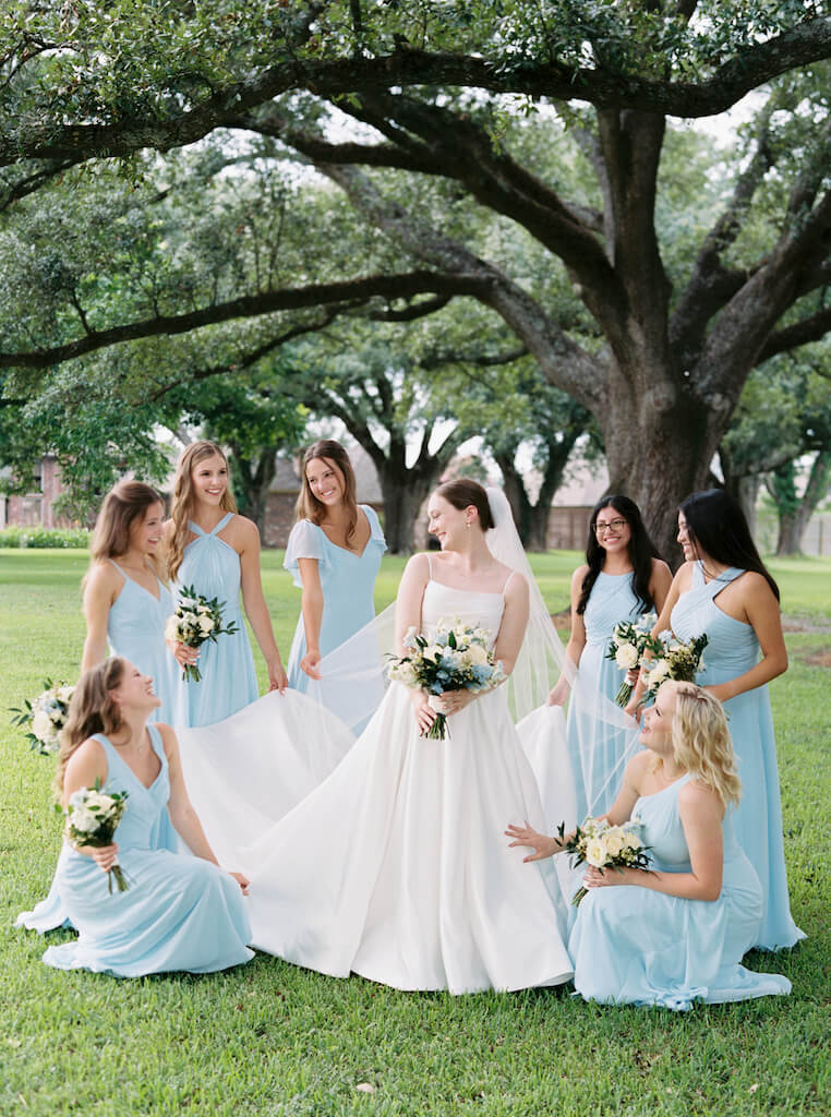 Bride with bridesmaids portrait at Olivia and Landon's Oak Crossing Wedding in Lake Charles, LA, photographed by Morgan Alysse Photography.