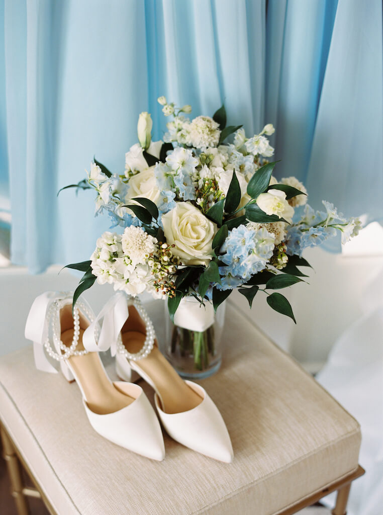 Blue and white bridal bouquet and classic shoes with pearl details at Olivia and Landon's Oak Crossing Wedding in Lake Charles, LA, photographed by Morgan Alysse Photography.