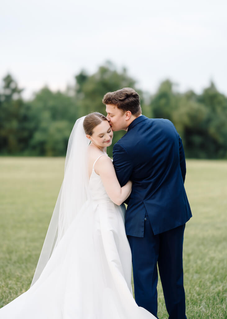 Bride and groom portrait at Olivia and Landons Oak Crossing Wedding at  in Lake Charles, LA, photographed by Morgan Alysse Photography.