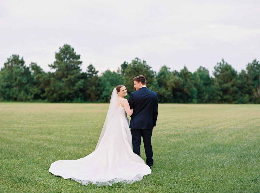 Bride and groom portrait at Olivia and Landons Oak Crossing Wedding at  in Lake Charles, LA, photographed by Morgan Alysse Photography.