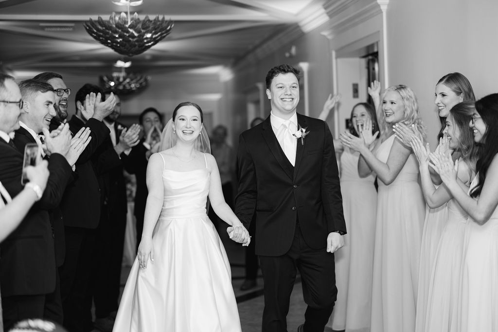 Bride and groom entering their reception at Olivia and Landon's Oak Crossing Wedding in Lake Charles, LA, photographed by Morgan Alysse Photography.