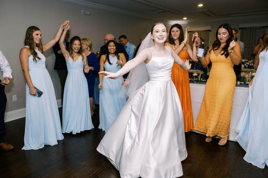 Bride and groom dancing with guests at their Oak Crossing Wedding in Lake Charles, LA, photographed by Morgan Alysse Photography.