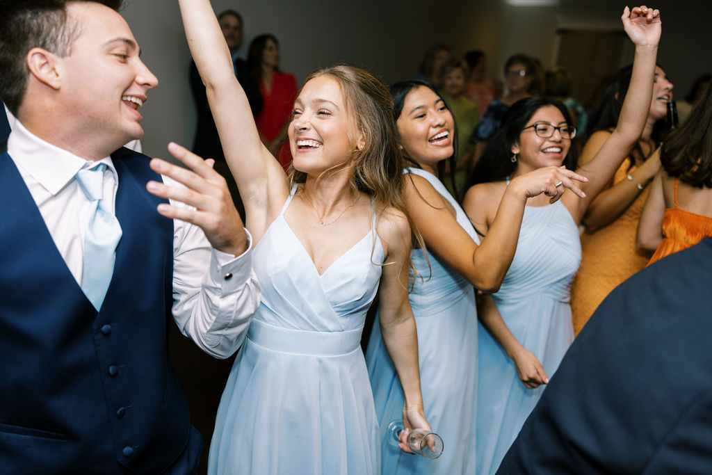 Bride and groom dancing with guests at their Oak Crossing Wedding in Lake Charles, LA, photographed by Morgan Alysse Photography.