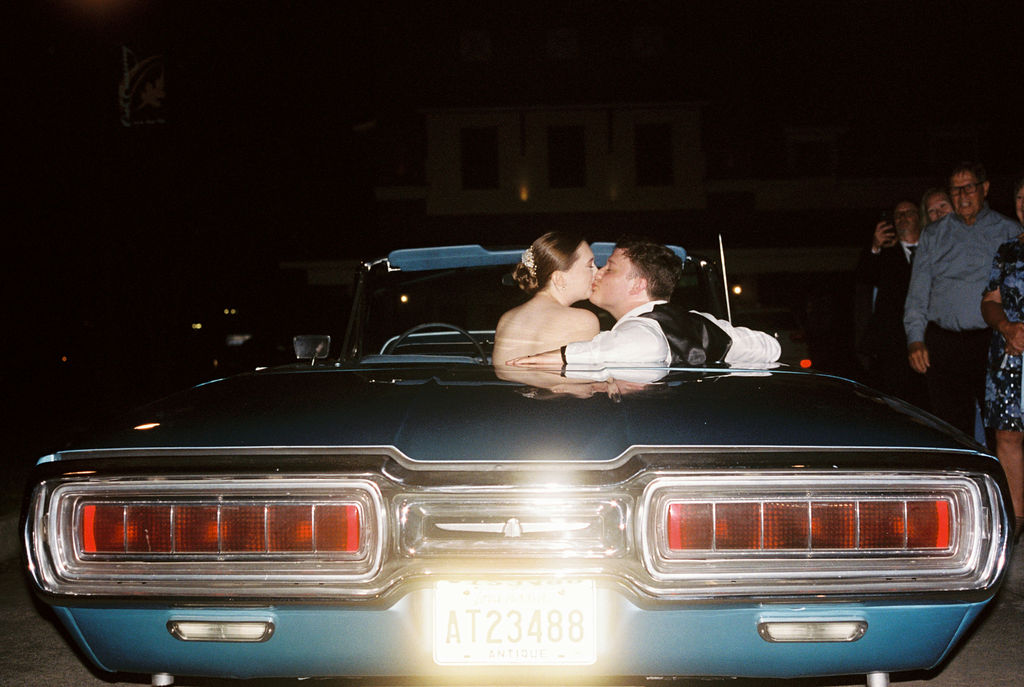 Bride surprising groom with vintage thunderbird exit car at their Oak Crossing Wedding in Lake Charles, LA, photographed by Morgan Alysse Photography.