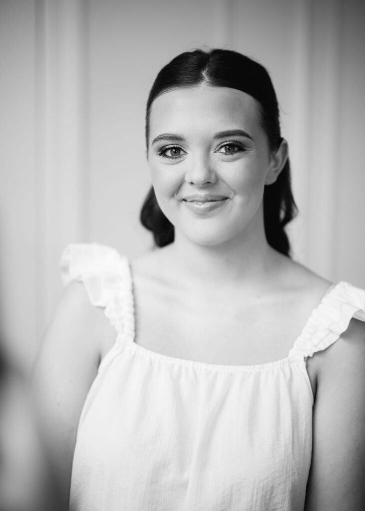 Black and white portrait of bride before Lauren and Colby's rainy day wedding at The Madison in Broussard, LA, photographed by Morgan Alysse Photography.