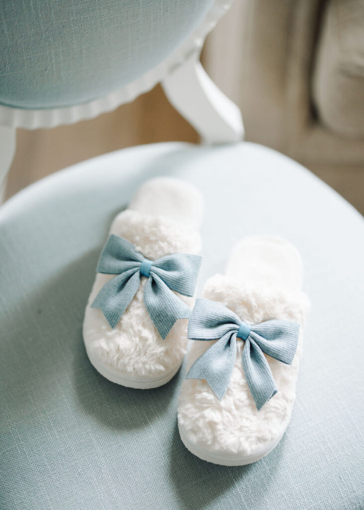 Getting ready slippers at Lauren and Colby's rainy day wedding at The Madison in Broussard, LA, photographed by Morgan Alysse Photography.