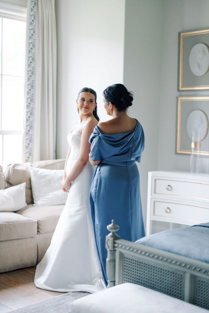 Bride and mother of the bride at Lauren and Colby's rainy day wedding at The Madison in Broussard, LA, photographed by Morgan Alysse Photography.