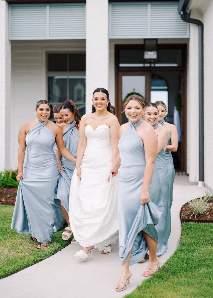 Bride and bridesmaids at Lauren and Colby's rainy day wedding at The Madison in Broussard, LA, photographed by Morgan Alysse Photography.