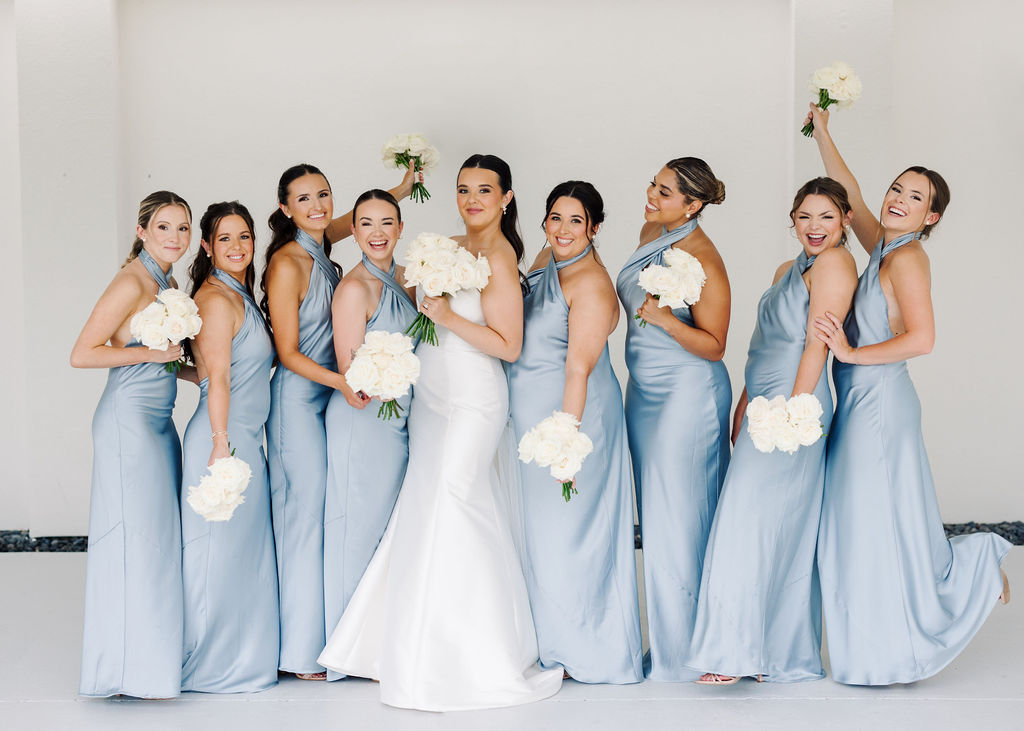 Bride with bridesmaids portrait at Lauren and Colby's rainy day wedding at The Madison in Broussard, LA, photographed by Morgan Alysse Photography.