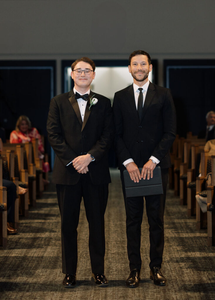 Groom with officiant at Lauren and Colby's rainy day wedding ceremony at Our Savior's Church in Lafayette, LA, photographed by Morgan Alysse Photography.