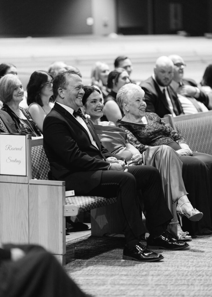 Ceremony guests at Lauren and Colby's rainy day wedding ceremony at Our Savior's Church in Lafayette, LA, photographed by Morgan Alysse Photography.