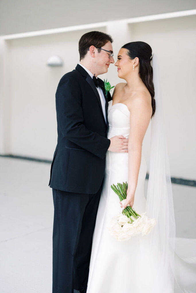 Bride and groom portrait at Lauren and Colby's rainy day wedding at The Madison in Broussard, LA, photographed by Morgan Alysse Photography.