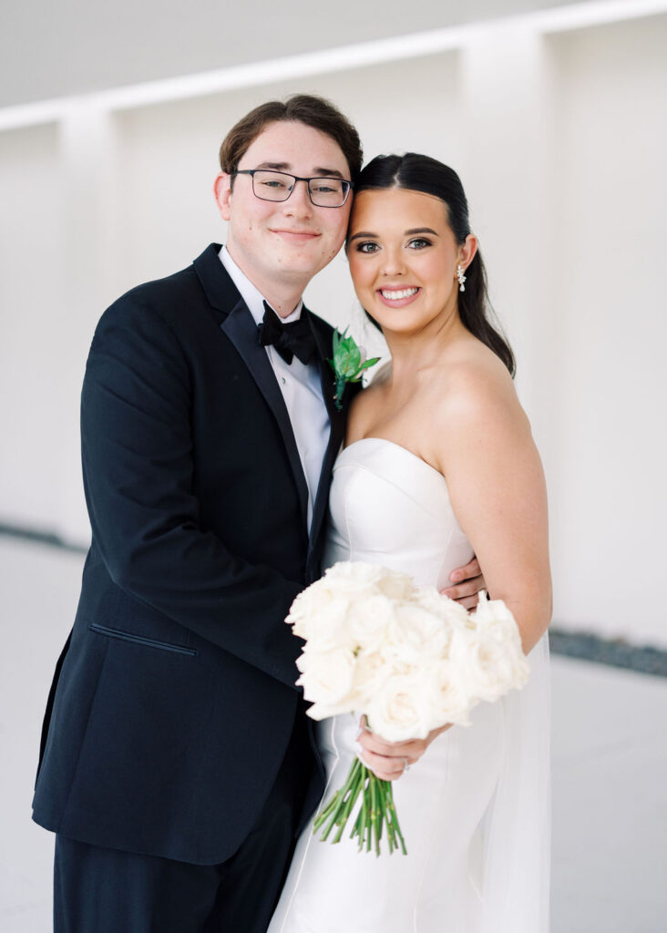 Bride and groom portrait at Lauren and Colby's rainy day wedding at The Madison in Broussard, LA, photographed by Morgan Alysse Photography.