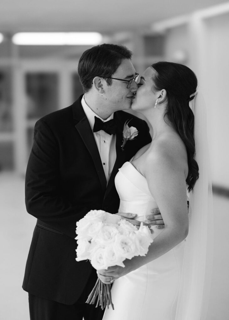 Black and white bride and groom portrait at Lauren and Colby's rainy day wedding at The Madison in Broussard, LA, photographed by Morgan Alysse Photography.