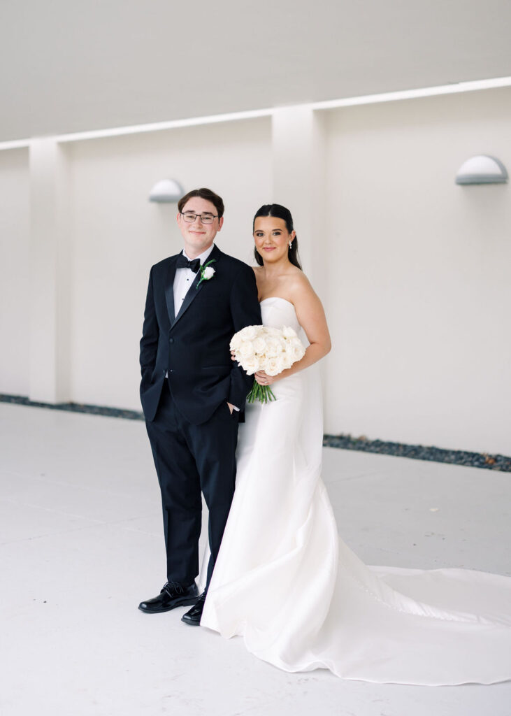 Bride and groom portrait at Lauren and Colby's rainy day wedding at The Madison in Broussard, LA, photographed by Morgan Alysse Photography.