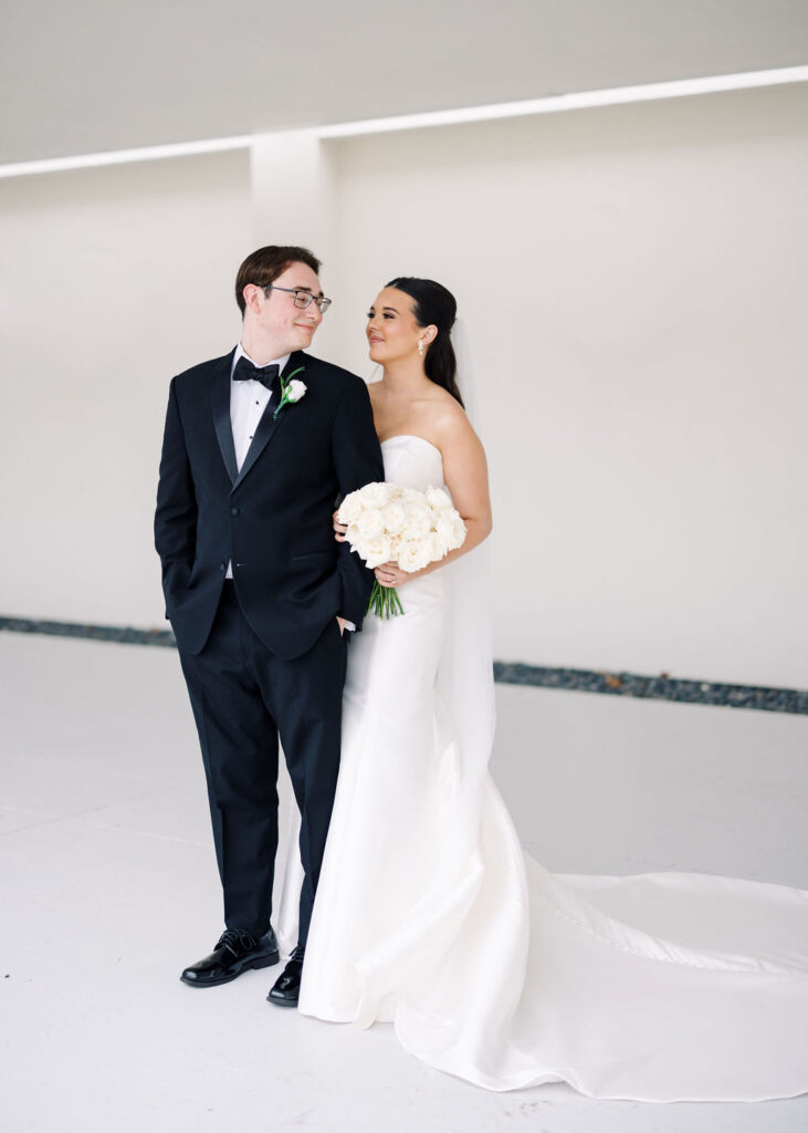 Bride and groom portrait at Lauren and Colby's rainy day wedding at The Madison in Broussard, LA, photographed by Morgan Alysse Photography.