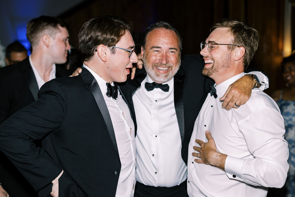 Groom with two other men at Lauren and Colby's rainy day wedding at The Madison in Broussard, LA, photographed by Morgan Alysse Photography.