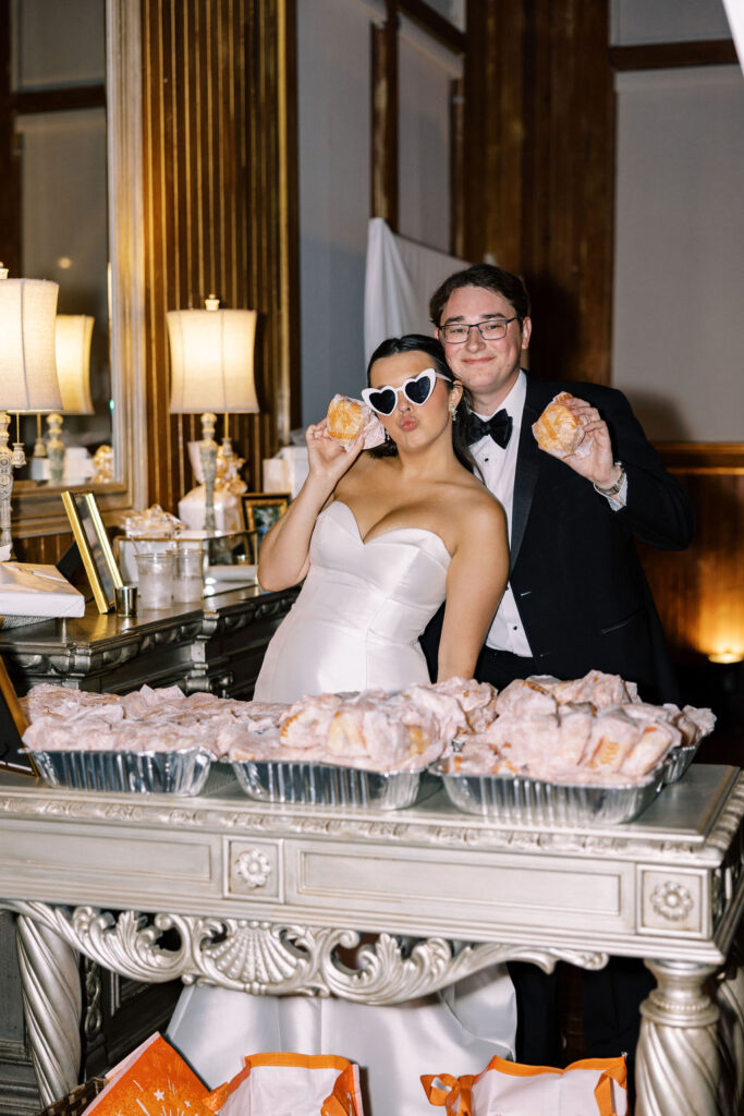 Bride and groom with late night snack at Lauren and Colby's rainy day wedding at The Madison in Broussard, LA, photographed by Morgan Alysse Photography.