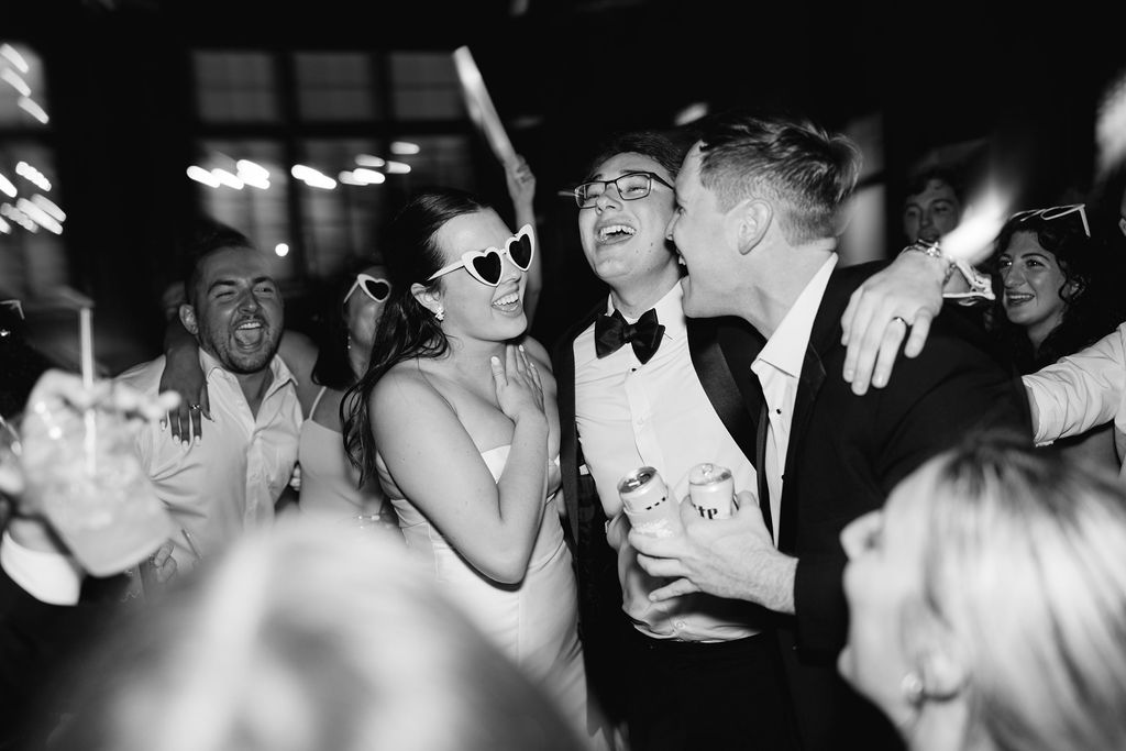 Black and white reception dancing at Lauren and Colby's rainy day wedding at The Madison in Broussard, LA, photographed by Morgan Alysse Photography.