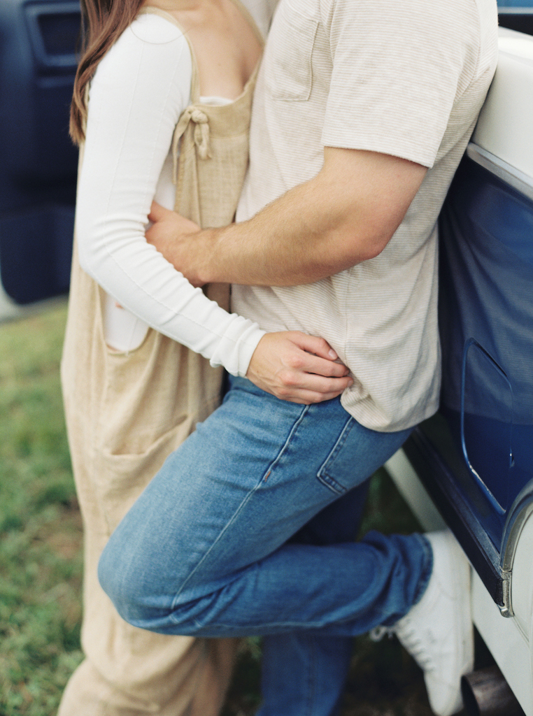 Romantic candid engagement session with a vintage truck near Lafayette, Louisiana, shot by Morgan Alysse Photography.