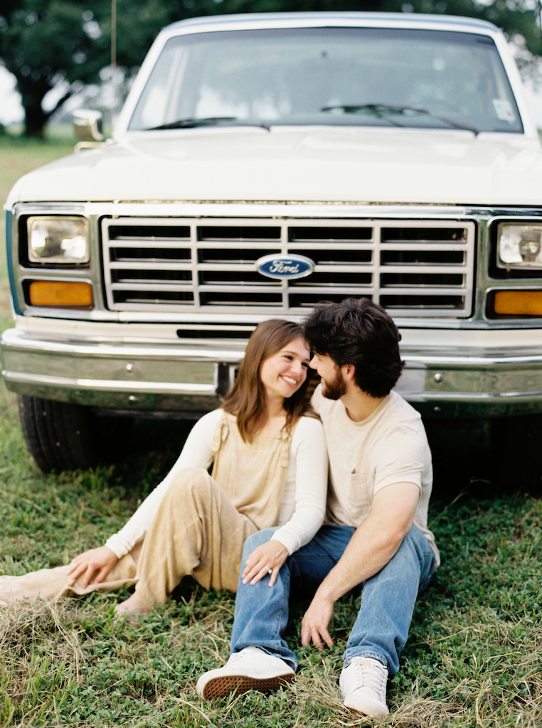 Romantic candid engagement session with a vintage truck near Lafayette, Louisiana, shot by Morgan Alysse Photography.