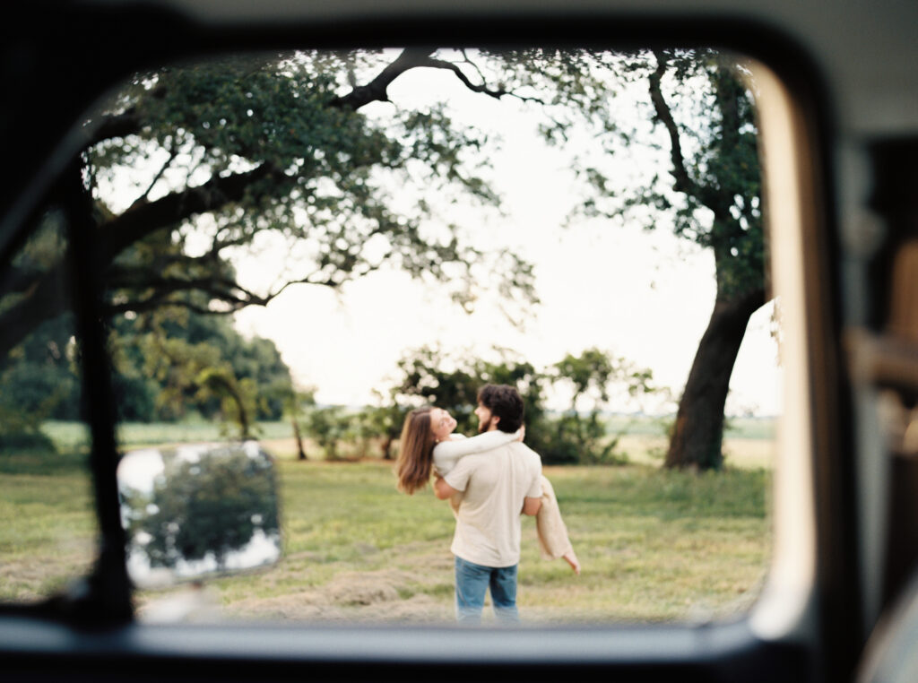 Romantic candid engagement session with a vintage truck near Lafayette, Louisiana, shot by Morgan Alysse Photography.