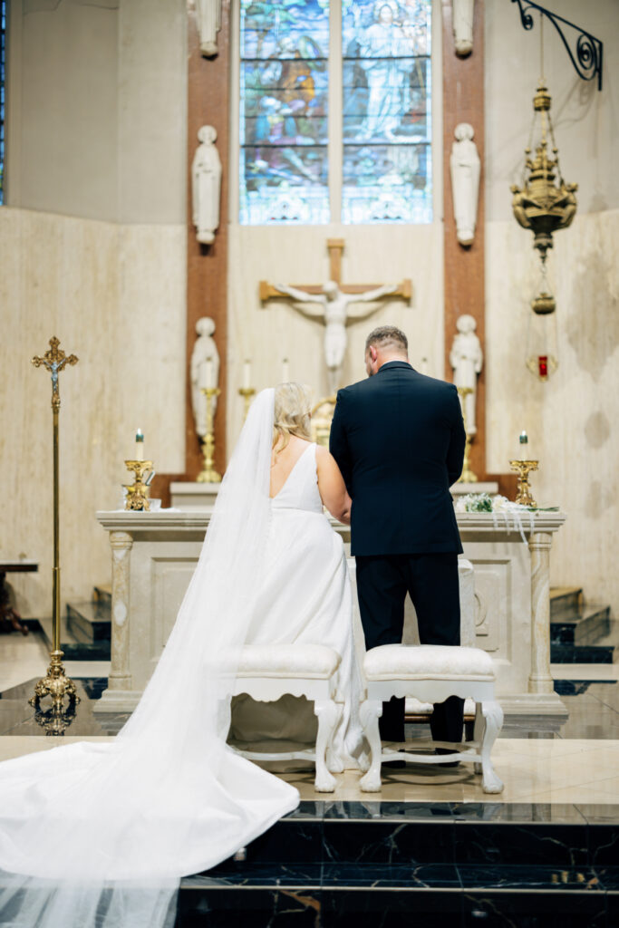 Bride and groom at their wedding at St Landry Catholic Church captured by Morgan Alysse Photography