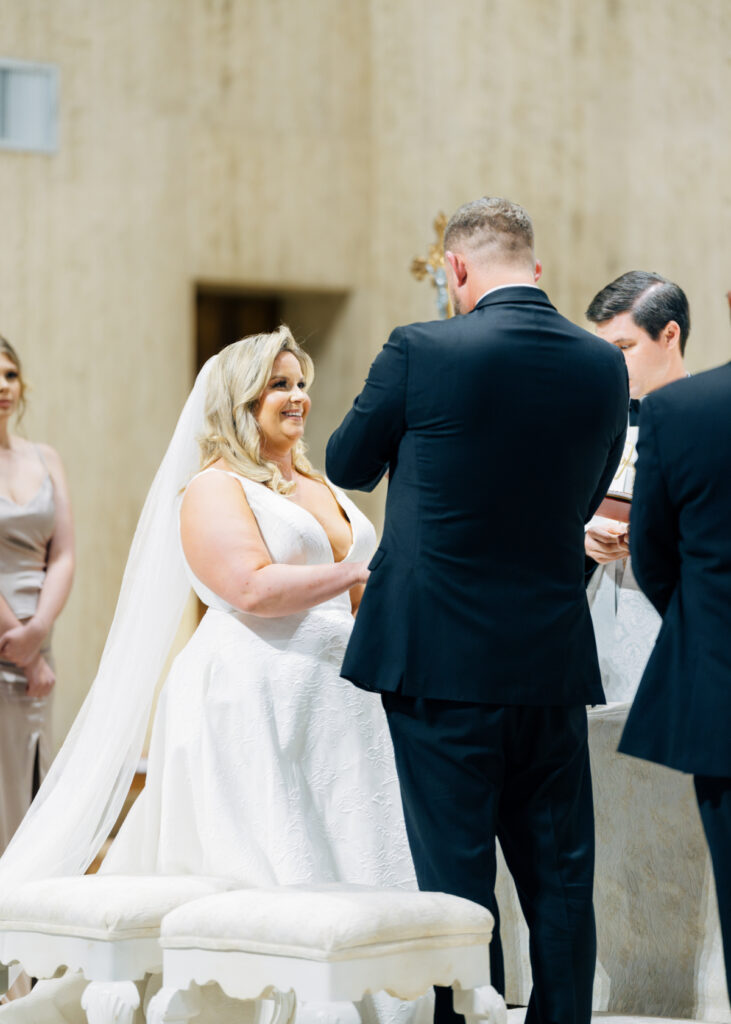 Bride and groom at their wedding at St Landry Catholic Church captured by Morgan Alysse Photography