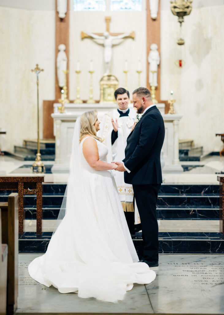 Bride and groom at their wedding at St Landry Catholic Church captured by Morgan Alysse Photography