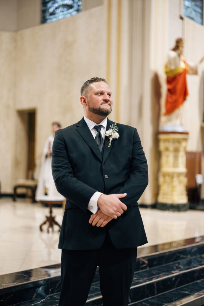 Groom at his wedding at St Landry Catholic Church captured by Morgan Alysse Photography