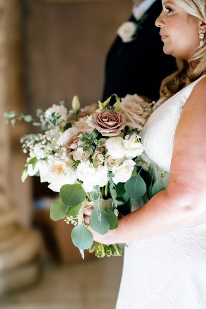 Bride holding her bouquet at her wedding at St Landry Catholic Church captured by Morgan Alysse Photography