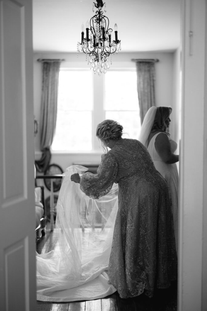 Bride's mother fixing her veil before her Opelousas wedding captured by Morgan Alysse Photography