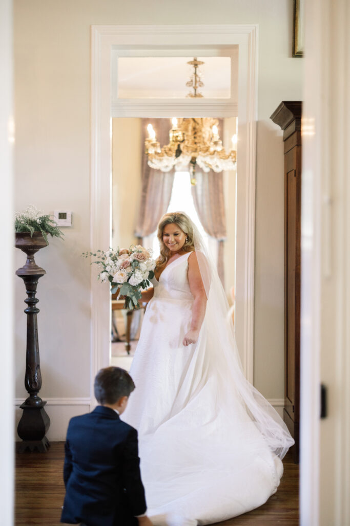 Bride's young son seeing his mother before her Opelousas wedding captured by Morgan Alysse Photography