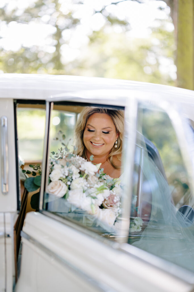 Bride in a Rolls Royce at her Opelousas wedding with photos taken by Morgan Alysse Photography