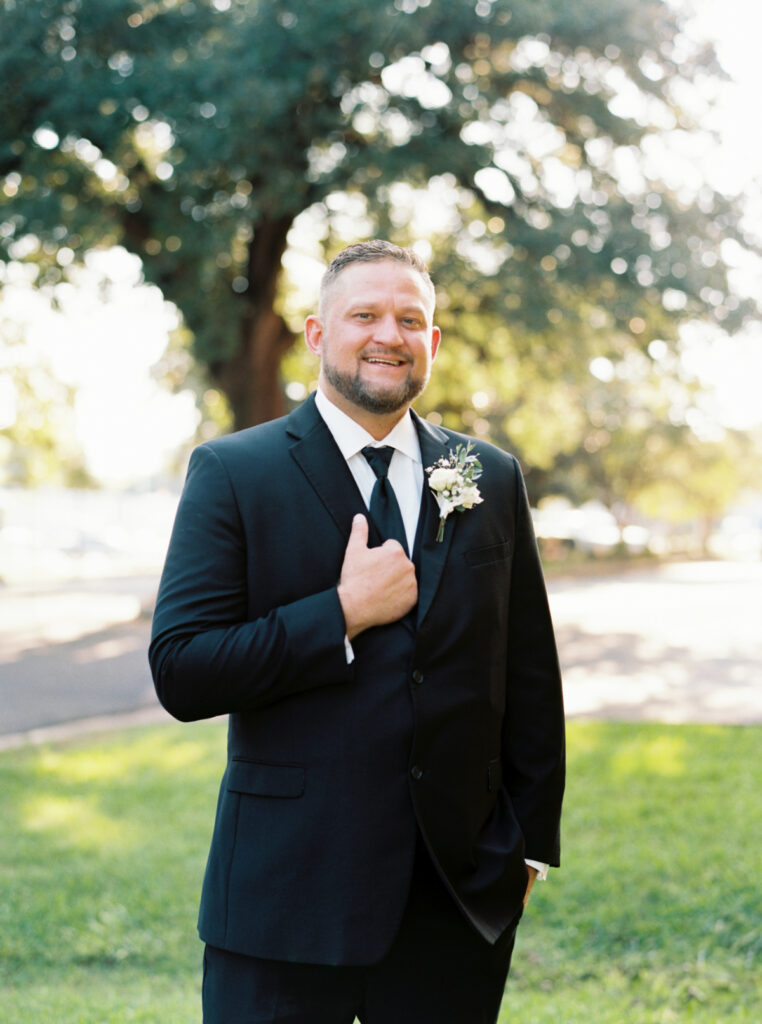 Groom portrait dressed in black tuxedo before his Opelousas wedding captured by Morgan Alysse Photography