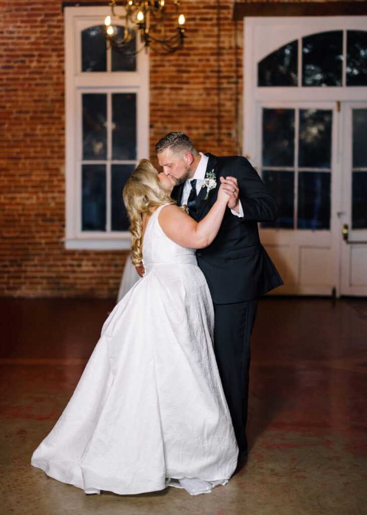 Bride and groom first dance at their wedding reception at Wolff Banquets & Receptions captured by Morgan Alysse Photography