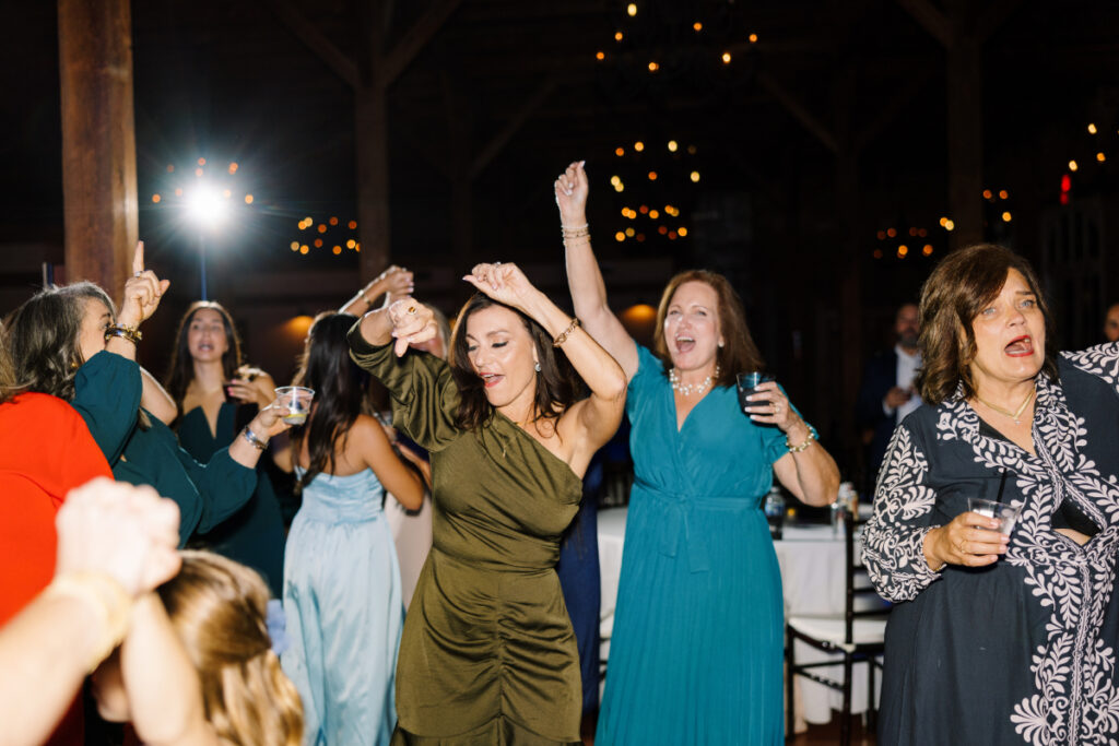 Guests dance at a wedding reception at Wolff Banquets & Receptions captured by Morgan Alysse Photography