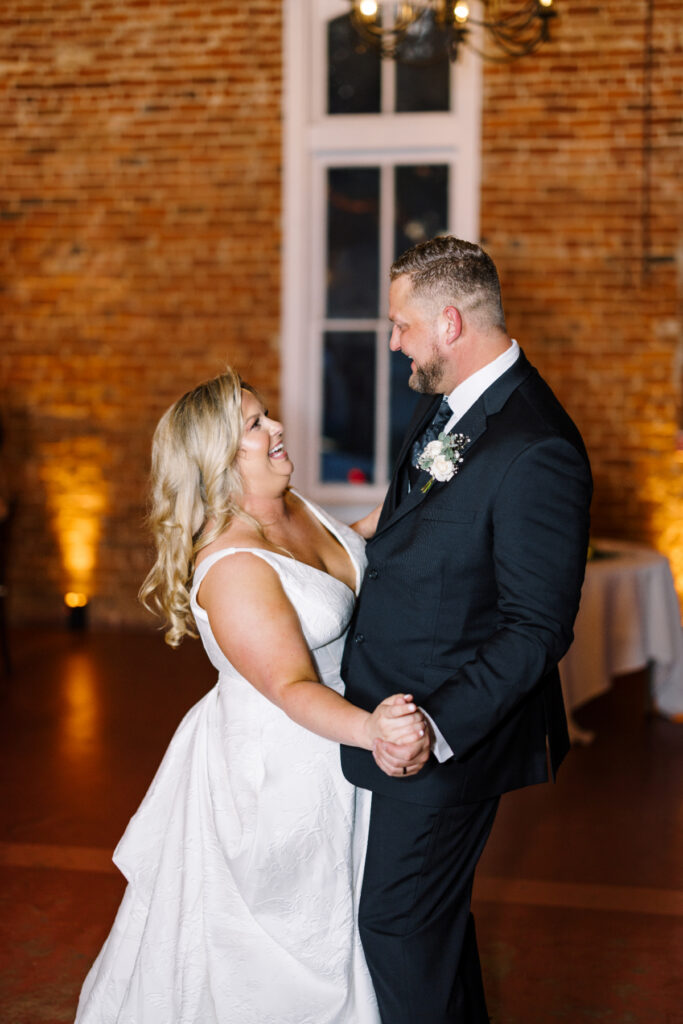 Bride and groom first dance at their wedding reception at Wolff Banquets & Receptions captured by Morgan Alysse Photography