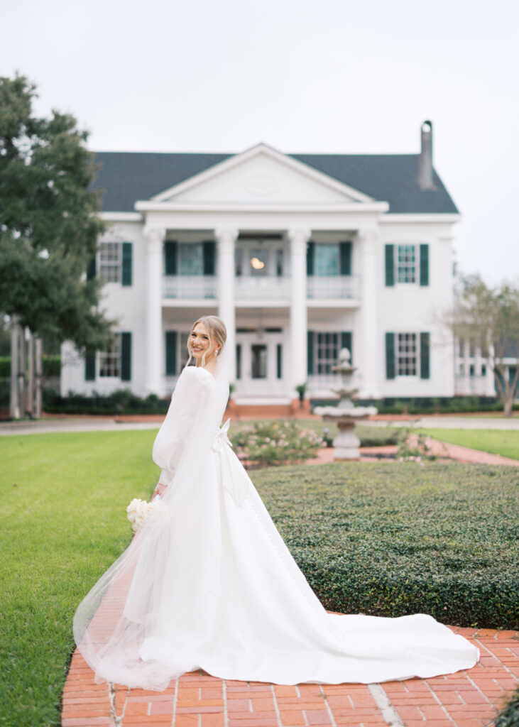 Bridal portrait photo with a veil and a white rose bouquet at Arlington Mansion taken by Morgan Alysse Photography